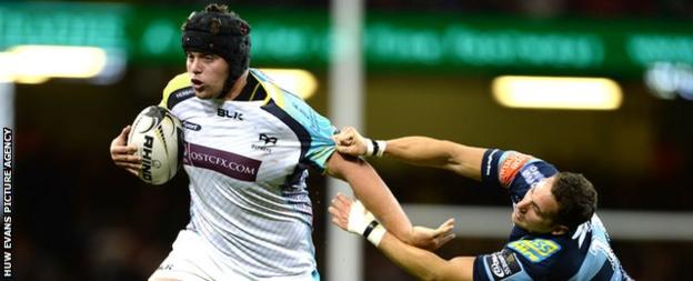 Nicky Smith (left) hands off Cardiff Blues winger Joaquin Tuculet