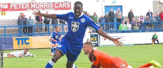 Adriano Moke celebrates a goal for Macclesfield Town