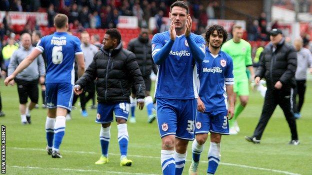 Cardiff defender Sean Morrison applauds the travelling fans after the win at Forest