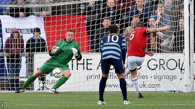 Jon-Paul McGovern scores a penalty for Ayr United against Forfar Athletic
