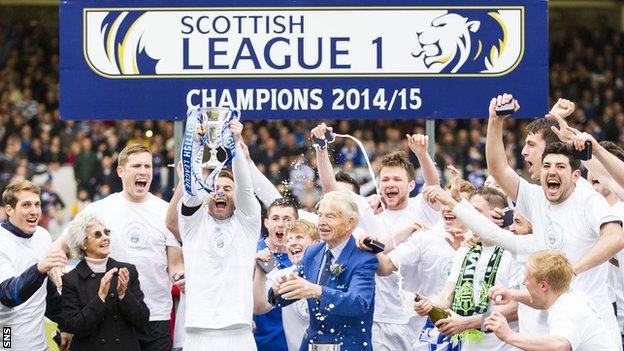 Greenock Morton players celebrate with the Scottish League One trophy