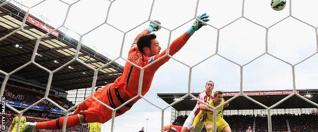 Stoke City midfielder Charie Adam scores against Tottenham