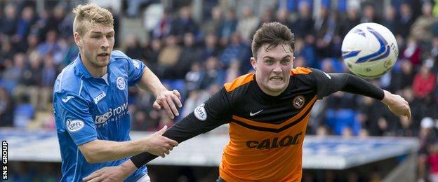 Dundee United's John Souttar (right) battles for the ball against St Johnstone's David Wotherspoon
