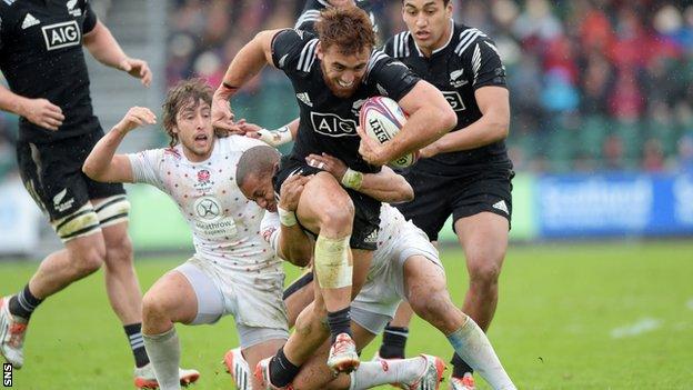 New Zealand's Joe Webber (front) is tackled by Marcus Watson