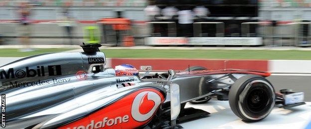 Jenson Button drives Mclaren's 2013 car in New Delhi
