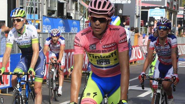 Alberto Contador rides in the leader's pink jersey
