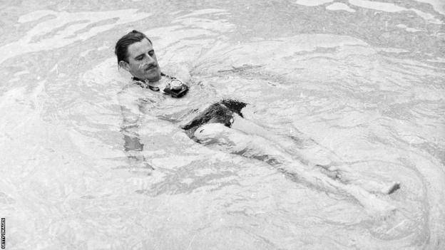 Graham Hill in the pool 1966