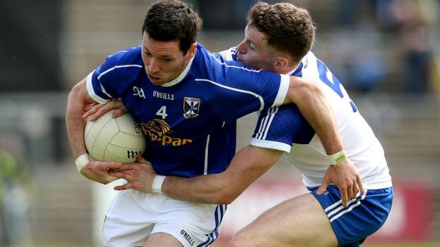 Cavan's Ronan Flanagan comes under pressure from Fintan Kelly of Monaghan