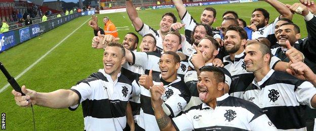 Zane Kirchner leads the taking of a selfie with the victorious Barbarians after the win over Ireland
