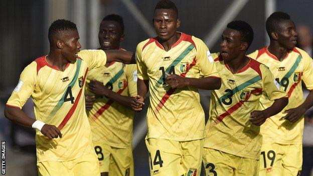 Mali players celebrate scoring against Mexico