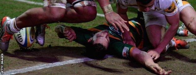 George North lies unconscious on the ground after being accidentally kneed in the head by Wasps' Nathan Hughes