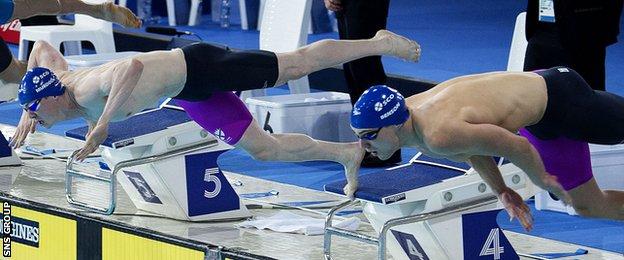 Scotland's Ross Murdoch (left) and Craig Benson dive into the Tollcross pool
