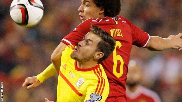 Axel Witsel of Belgium and Aaron Ramsey of Wales tussle for the ball