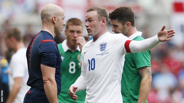 England striker Wayne Rooney speaks to the referee during the match against the Republic of Ireland