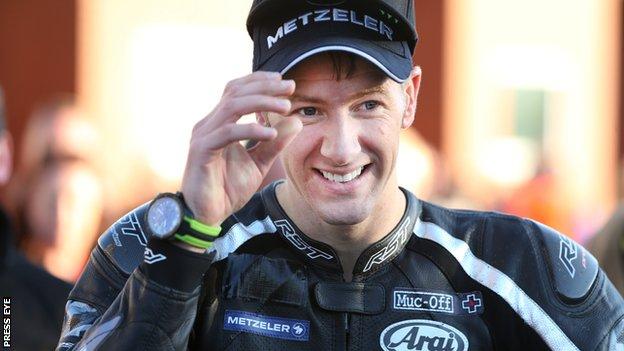 Ian Hutchinson acknowledges the spectators after his Isle of Man Supersport triumph on Monday