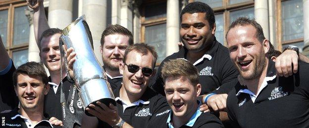 Glasgow Warriors players celebrating with the Pro12 trophy