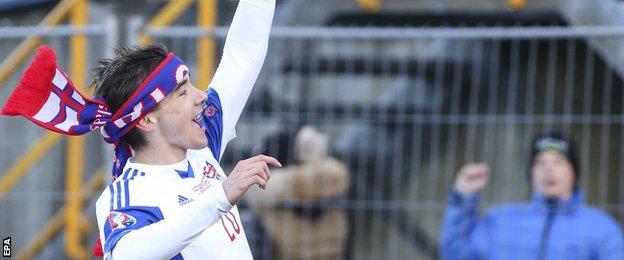 Faroe Islands player Rene Joensen celebrates after his side defeat Greece in a Euro 2016 qualifier