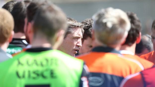 Armagh manager Kieran McGeeney talks to his defeat Armagh players after the Championship match against Donegal