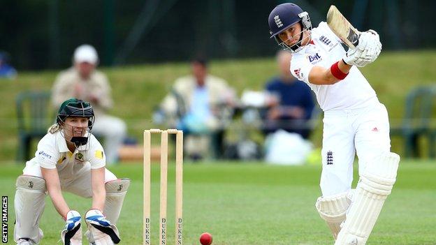 Arran Brindle hits out during the 2013 Women's Ashes, watched by Australia captain Jodie Fields