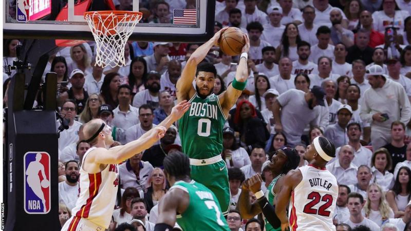 Boston Celtics edge past Miami Heat to keep their NBA play-off hopes alive.
