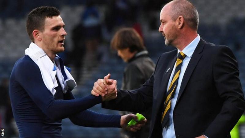 Robertson shaking hands with coach