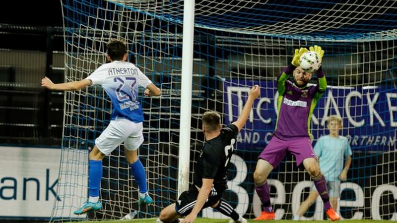 Irish schoolboy Christopher Atherton became UK's youngest senior footballer.