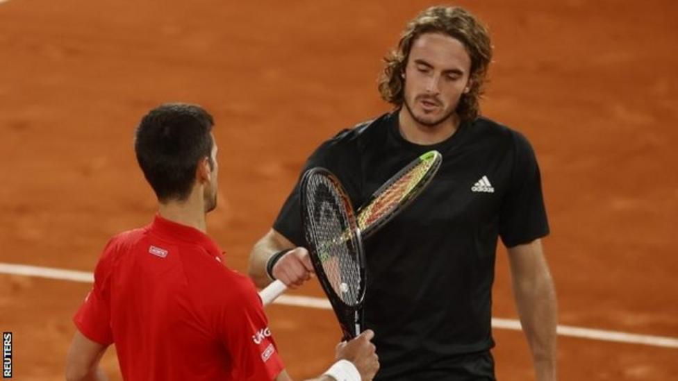 Novak Djokovic and Stefanos Tsitsipas tap racquets at the net after their t...