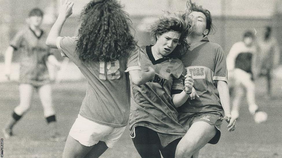 A keen sportswoman, Blainey (centre) also played football in high school