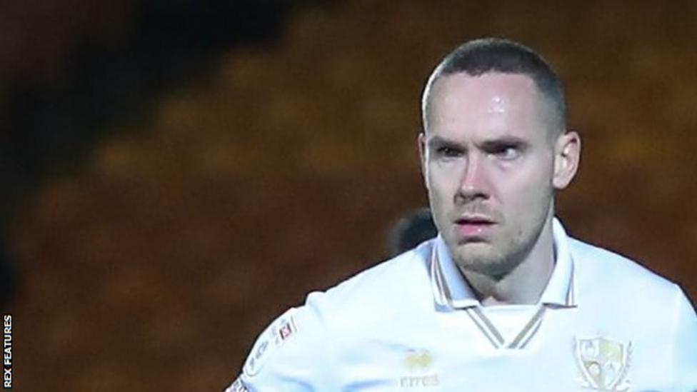 Stockport County sign defender Chris Hussey and forward Daniel Okwute