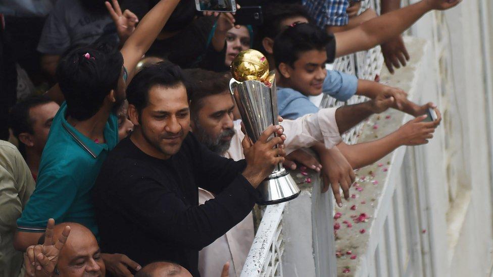 Sarfraz Ahmed holds aloft the Champions Trophy