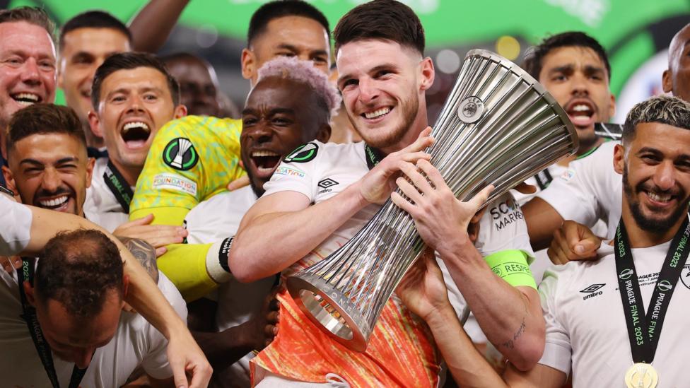 Declan Rice celebrates with the trophy after West Ham's victory