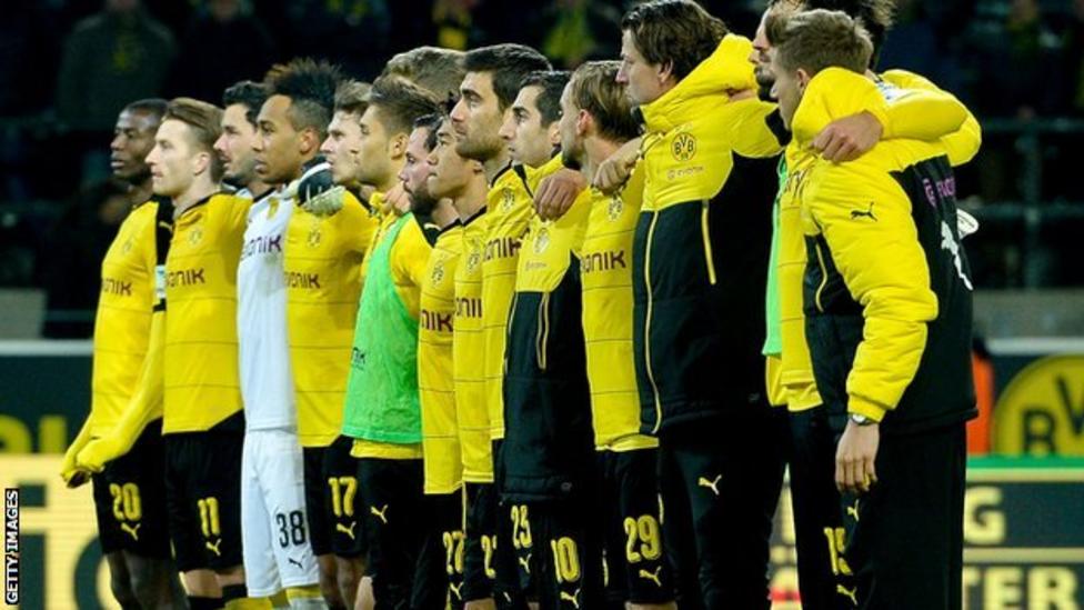 Borussia Dortmund supporter dies after falling ill in stadium - BBC Sport