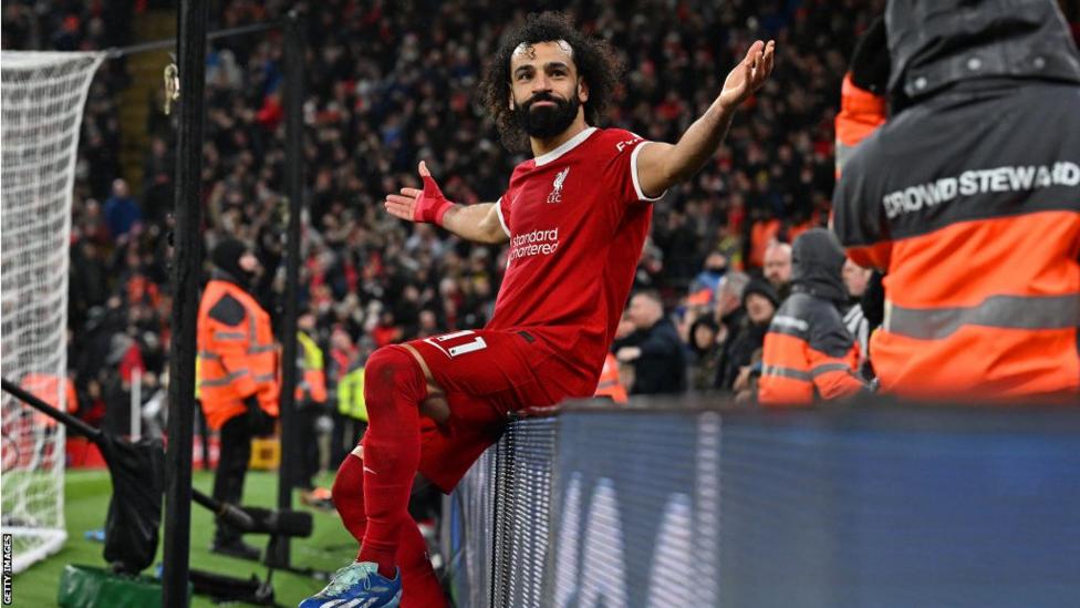Mohamed Salah celebrates after scoring a goal