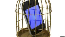 Teléfono dentro de una jaula