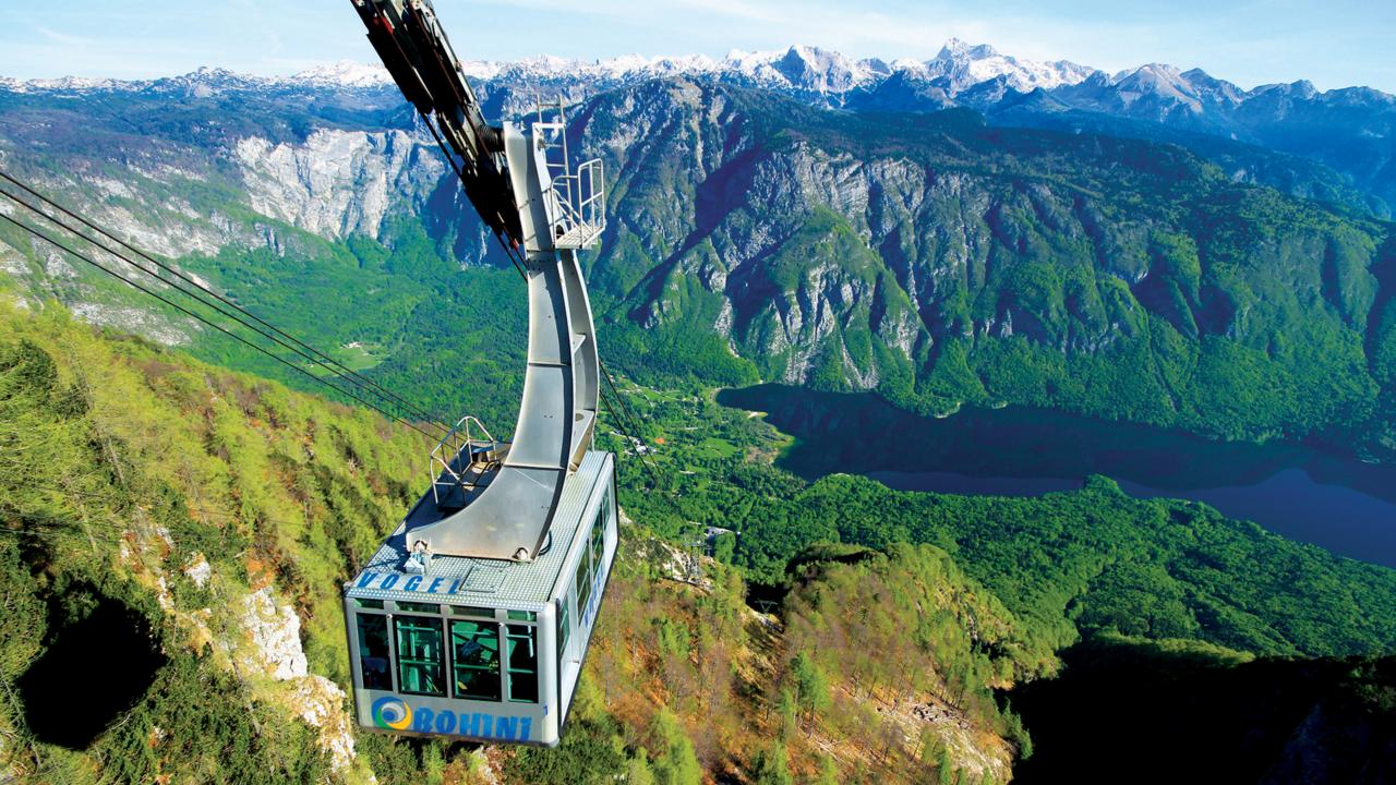 A cable car pulls up to the snow-covered top of Mount Vogel (Credit: Credit: Turizem Bohinj)