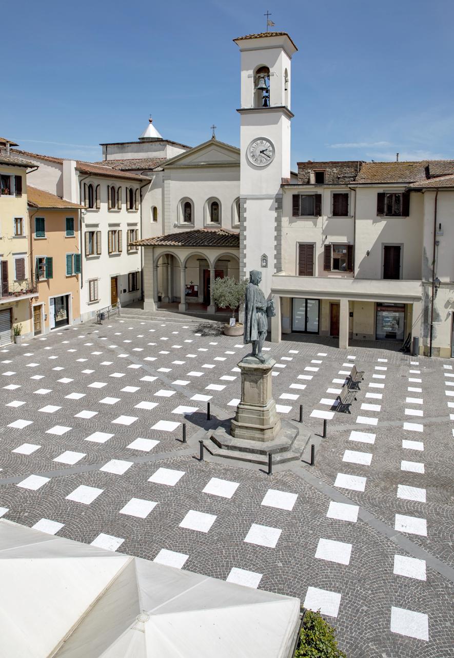 The painted grid pattern blends with the picturesque setting of the square (Credit: Giulio Margheri)