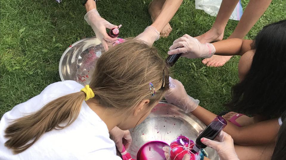 After a morning spent discussing the U.S.-China trade war the campers headed out into the sunshine to tie dye some t-shirts