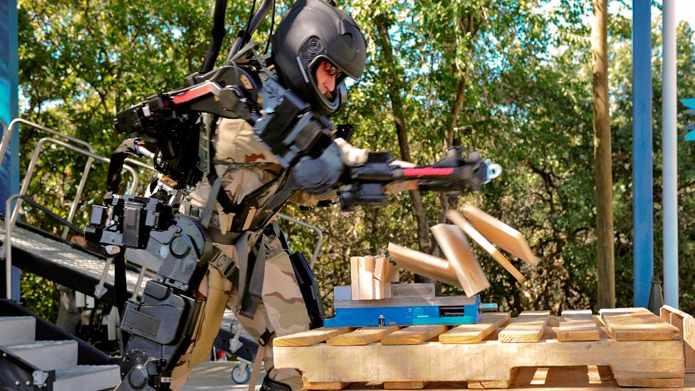 Warrior web is different from the tough exoskeletons being developed, like Raytheon’s XOS 2, which allow soldiers to carry heavy weights. (Copyright: Raytheon) Warrior web is different from the tough exoskeletons being developed, like Raytheon’s XOS 2, which allow soldiers to carry heavy weights. (Copyright: Raytheon)
