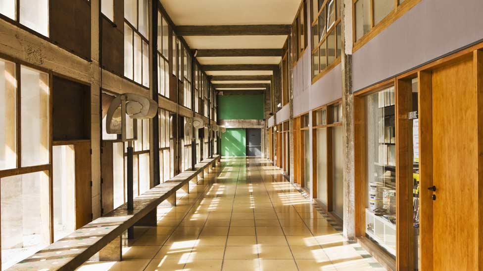 Inside, the apartments are arranged around wide central corridors which Le Corbusier envisioned as "vertical cities". (Corbis) Inside, the apartments are arranged around wide central corridors which Le Corbusier envisioned as "vertical cities". (Corbis)
