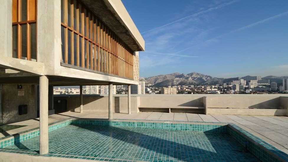With its children's art room, paddling pool and opportunities for sunbathing, L'Unité's roof provides a relaxing haven for its inhabitants. (Corbis) With its children's art room, paddling pool and opportunities for sunbathing, L'Unité's roof provides a relaxing haven for its inhabitants. (Corbis)