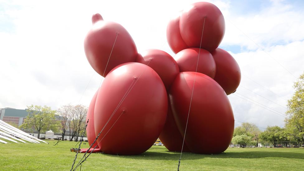 Paul McCarthy’s 80ft (24m) inflatable sculpture Balloon Dog overlooks the East River in the Sculpture Park at Frieze New York. (Zuma/Rex Features) Paul McCarthy’s 80ft (24m) inflatable sculpture Balloon Dog overlooks the East River in the Sculpture Park at Frieze New York. (Zuma/Rex Features)