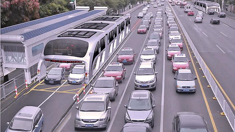 .In China, road users may share the tarmac with a bus which travels around them on special tracks, carrying passengers in a cabin above road traffic. (Copyright: Shenzen Hashi) .In China, road users may share the tarmac with a bus which travels around them on special tracks, carrying passengers in a cabin above road traffic. (Copyright: Shenzen Hashi)