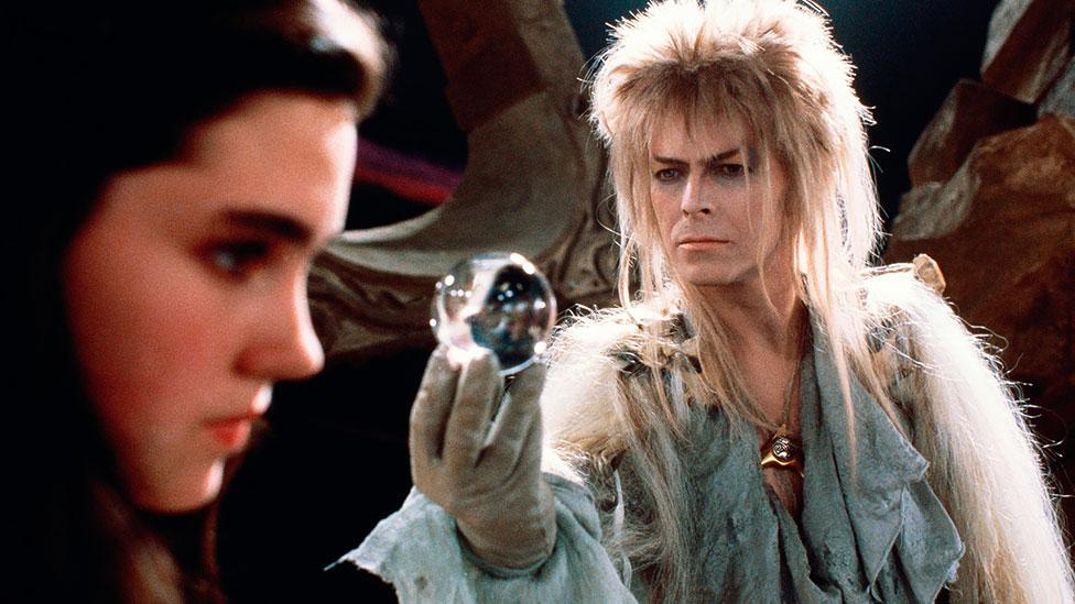 Starring with Jennifer Connelly (and Jim Henson puppets) in Labyrinth (1986), Bowie managed to pull off a feathered wig and some memorably tight grey leggings. (Rex Features) Starring with Jennifer Connelly (and Jim Henson puppets) in Labyrinth (1986), Bowie managed to pull off a feathered wig and some memorably tight grey leggings. (Rex Features)