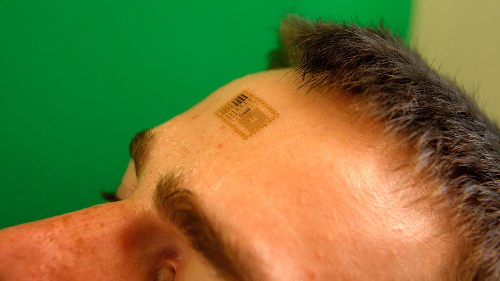 An alternative to implanted chips is the “electronic tattoo”, an adhesive worn on the skin. (John Rogers Research Group) An alternative to implanted chips is the “electronic tattoo”, an adhesive worn on the skin. (John Rogers Research Group)