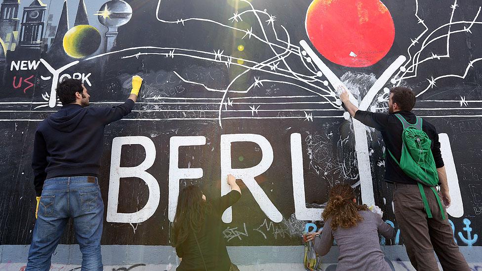 Volunteers maintain the murals of Berlin's East Side Gallery. (Adam Berry/Getty Images) Volunteers maintain the murals of Berlin's East Side Gallery. (Adam Berry/Getty Images)