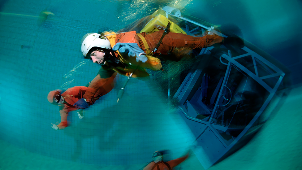 Breath-holding is part of the training for some jobs: a pilot practises escaping from a submerged aircraft cockpit in Brest, France. (Science Photo Library) Breath-holding is part of the training for some jobs: a pilot practises escaping from a submerged aircraft cockpit in Brest, France. (Science Photo Library)