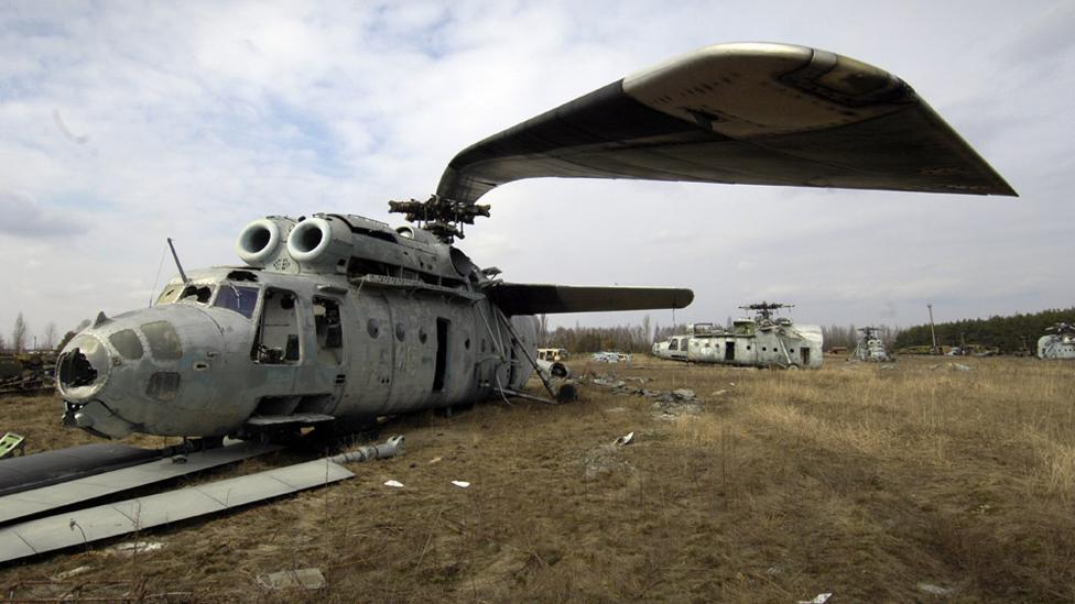 After the 1986 Chernobyl disaster, irradiated Soviet helicopters like this Mil Mi-6 were stored in a giant boneyard (Phil Coomes/BBC) After the 1986 Chernobyl disaster, irradiated Soviet helicopters like this Mil Mi-6 were stored in a giant boneyard (Phil Coomes/BBC)