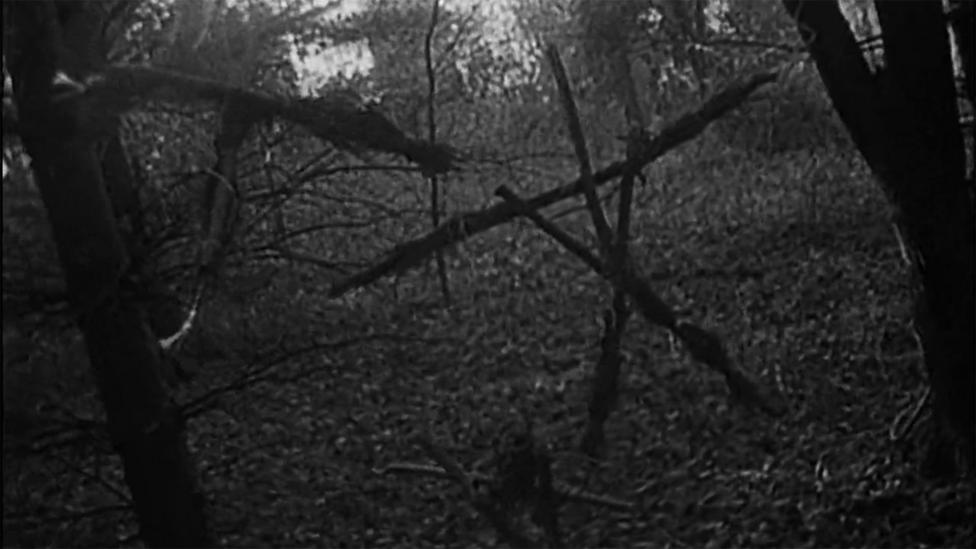 In Blair Witch, three students venture into the Maryland woods and find ominous arrangements of twigs and stones (Credit: Artisan Entertainment) In Blair Witch, three students venture into the Maryland woods and find ominous arrangements of twigs and stones (Credit: Artisan Entertainment)
