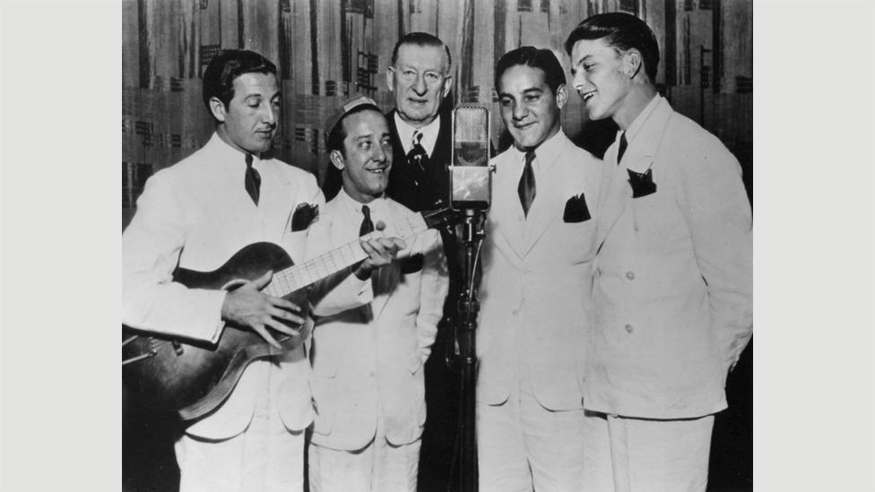 Sinatra sang with The Hoboken Four, seen here in 1935, before joining bandleader Tommy Dorsey, who he’d later call “The General Motors of the music business”. (Credit: Wikipedia) Sinatra sang with The Hoboken Four, seen here in 1935, before joining bandleader Tommy Dorsey, who he’d later call “The General Motors of the music business”. (Credit: Wikipedia)