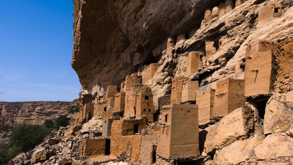 In cliff-side houses like these, some Malian villagers talk an enigmatic anti-language originally designed to fool slave-traders (Credit: Alamy) In cliff-side houses like these, some Malian villagers talk an enigmatic anti-language originally designed to fool slave-traders (Credit: Alamy)